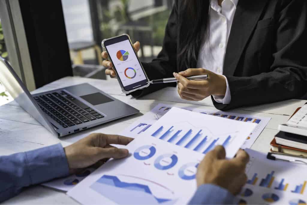 two business people sit down to analyze financial 2023 11 27 05 01 06 utc